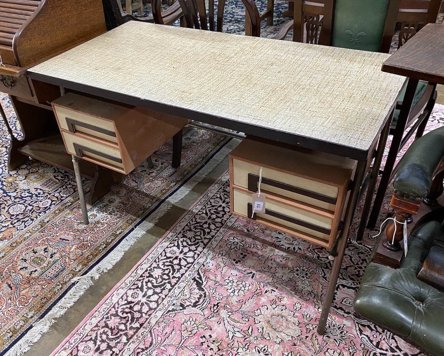 A 1970's kneehole desk with faux rattan top, length 109cm, depth 54cm, height 73cm